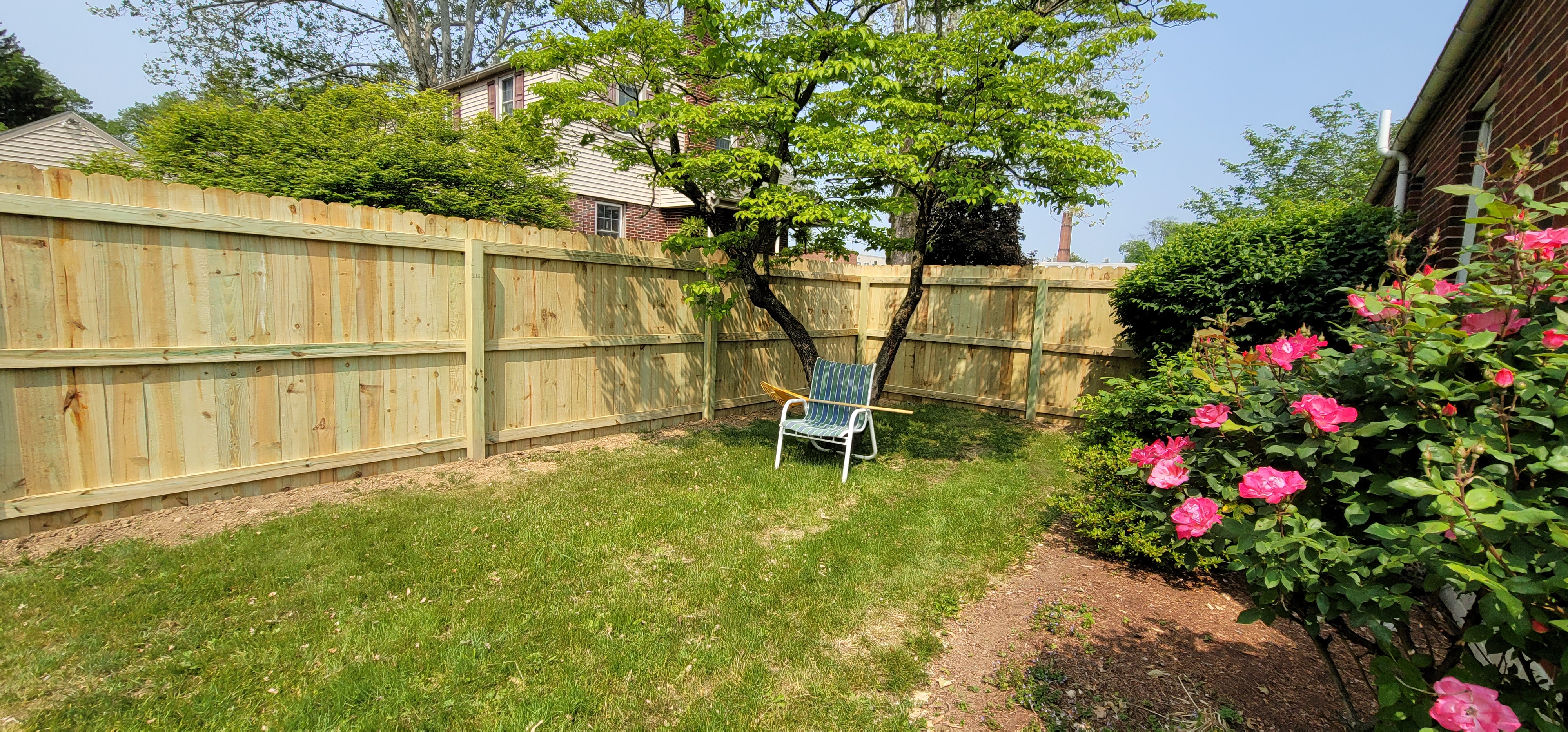 White vinyl privacy fence installed by Stauffer Brothers