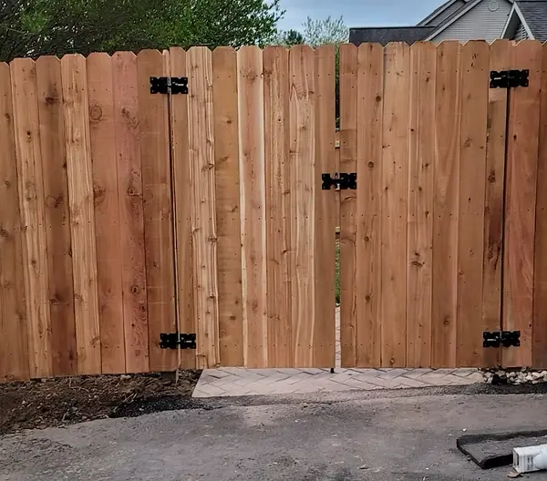 Cedar privacy fence with a wide double gate