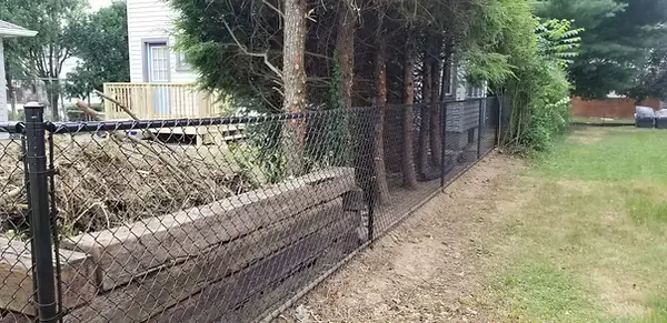 Black Chainlink Fence by Stauffer Brothers