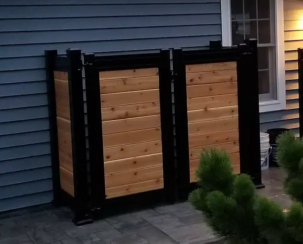 Cedar privacy screen panels framed with black posts